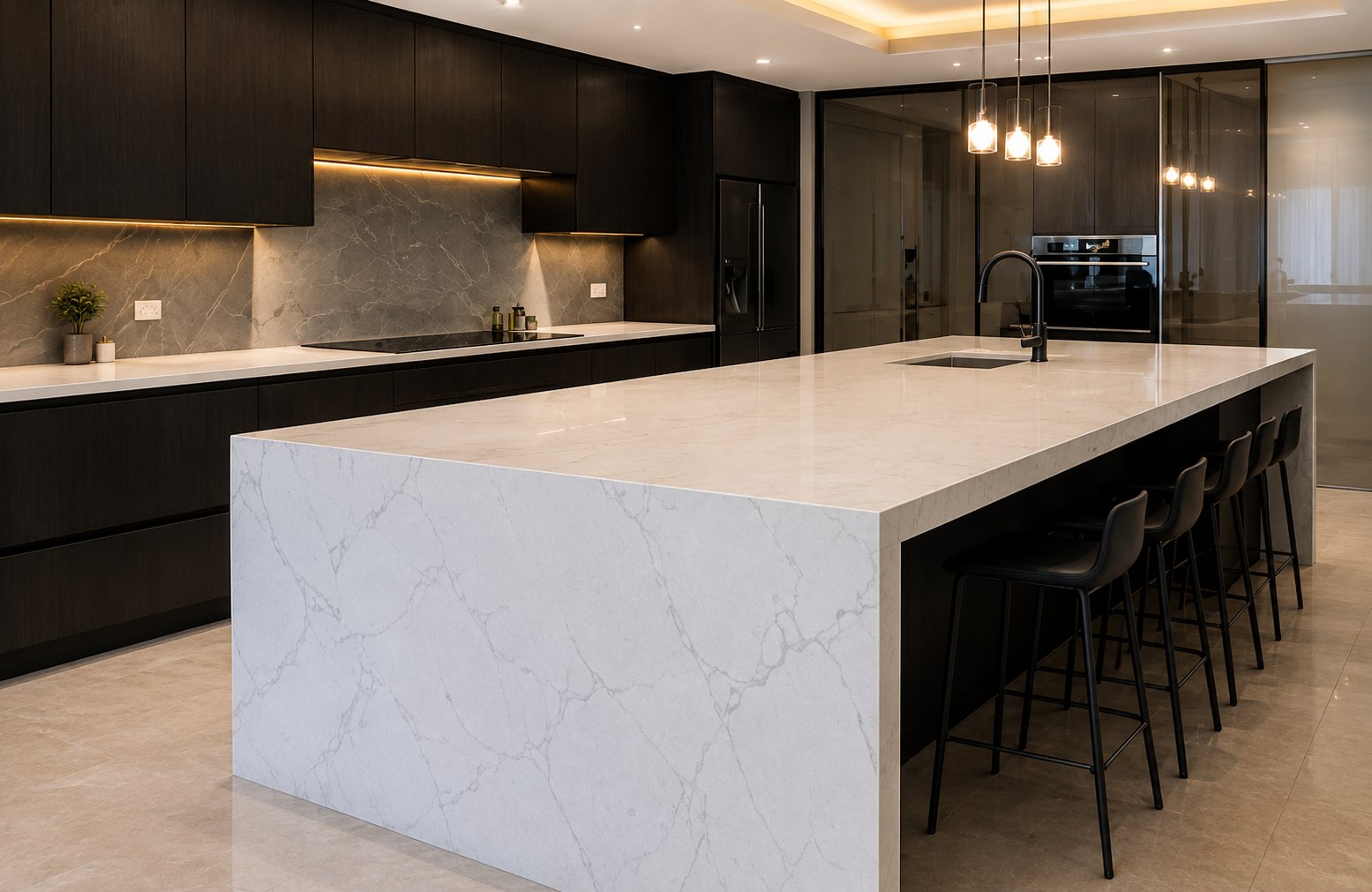 Dark stone kitchen with a pale waterfall island